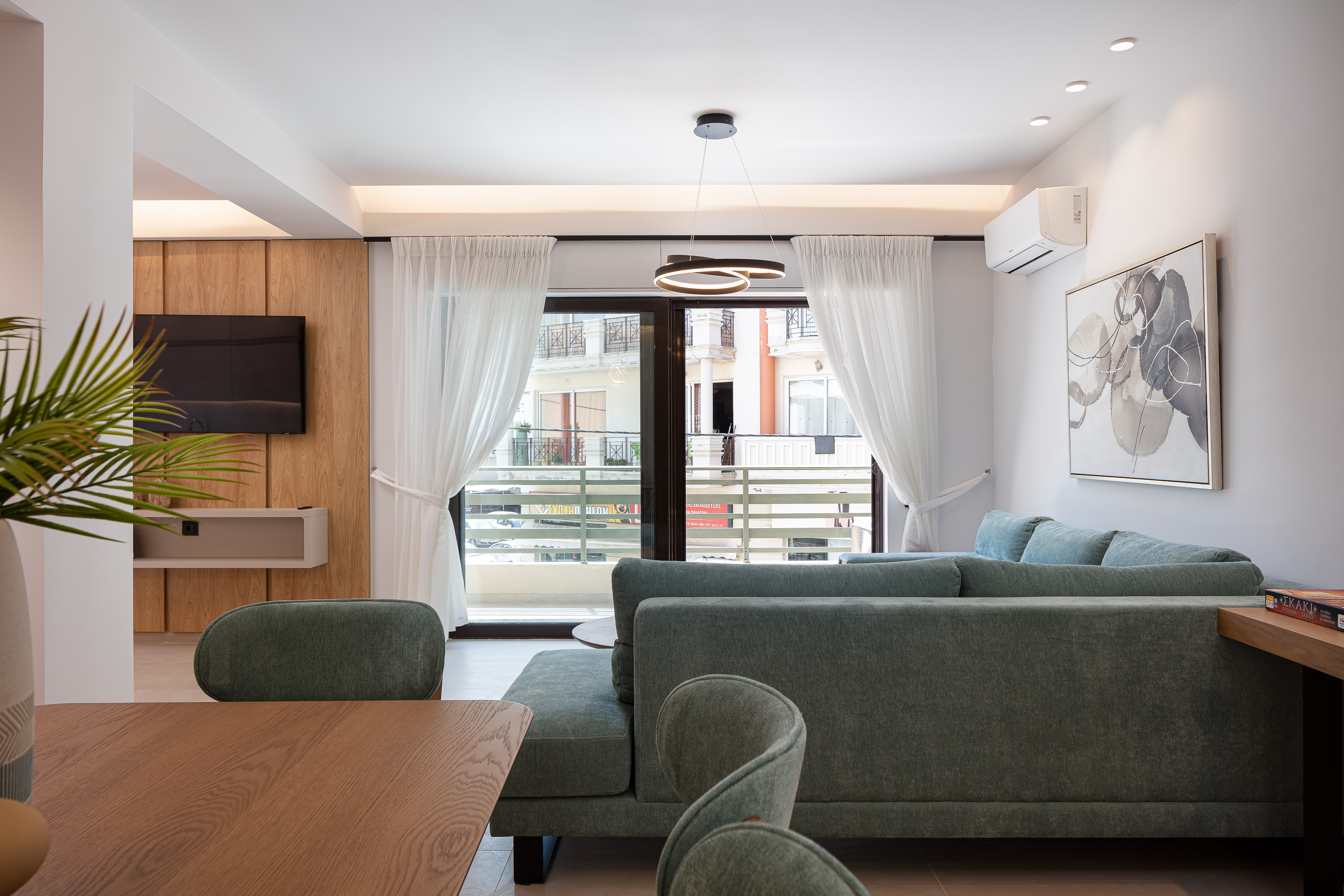 Bright living room with balcony access โ vacation rental Rethymno